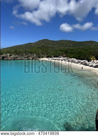 Grote Knip Beach View Of Crystal Clear Blue Green Water In The Carribean With A Blue Sky Back Ground