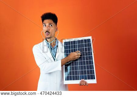 Doctor Or Veterinarian Isolated On Orange Background. Black Young Doctor Medical Resident With Steth