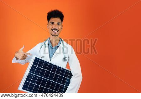 Doctor Or Veterinarian Isolated On Orange Background. Black Young Doctor Medical Resident With Steth