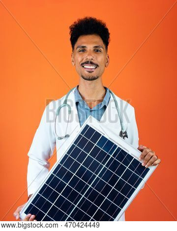 Doctor Or Veterinarian Isolated On Orange Background. Black Young Doctor Medical Resident With Steth