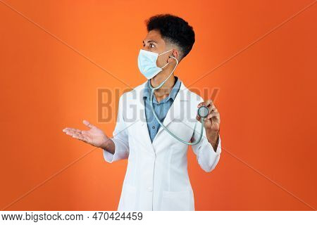 Doctor Or Veterinarian Isolated. Black Young Doctor Medical Resident With Stethoscope And Pandemic M