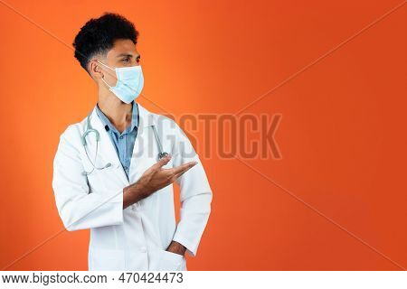 Doctor Or Veterinarian Isolated. Black Young Doctor Medical Resident With Stethoscope And Pandemic M