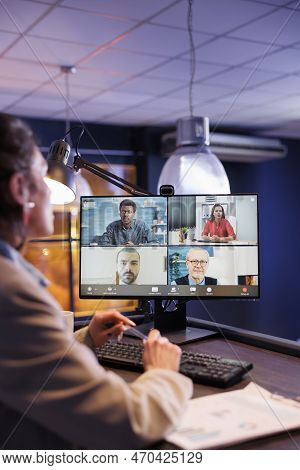 Executive Manager Having Remote Conversation With Business Team, Discussing Marketing Statistics. Co