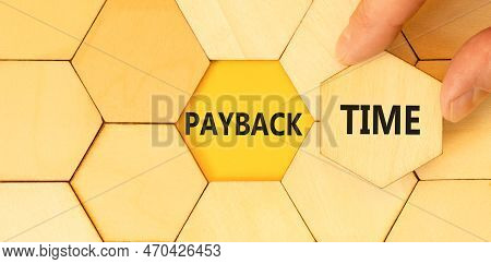 Payback Time Symbol. Concept Words Payback Time On Wooden Puzzles. Beautiful Yellow Table Yellow Bac
