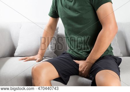 Asian Man Wants To Pee And Is Holding His Bladder.