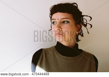 Portrait Teenage Girl With Brown Eyes, Brown Hair And Korean-style Makeup With Arrows And Dots Drawn
