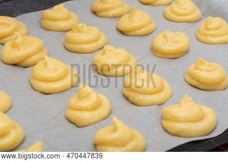 French Cheese Puffs. Gougeres French Pastries On A Dripping Pan Before Baking