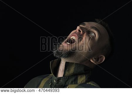 Close-up Of A Man, An Angry, Disgruntled Man Shouting. Caucasian Angry Man Screaming With His Head T