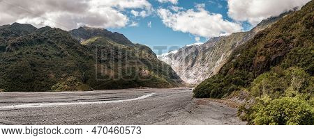 Panoramic View Of The Alluvial Bed Of The Waiho River Flowing From The Franz Josef Glacier And Snow 