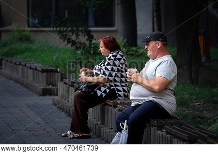Caransebes, Romania - September 16, 2022: Selective Blur On Two Romanian People, Seniors, Old Man An