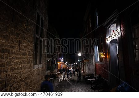 Aachen, Germany - November 8, 2022: Selective Blur On The Pontstrasse Street Of Aachen At Night, Wit