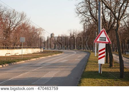 Typical European Railroad Crossing Sign On A City Road Indicating An Fenced Level Crossing Soon, Wit