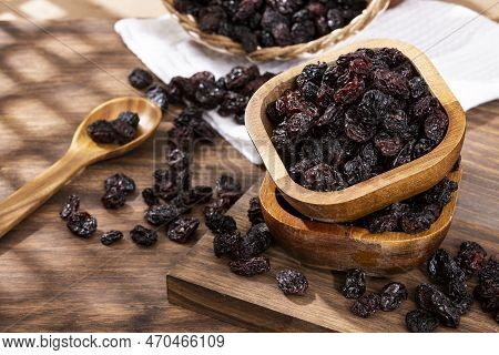 Healthy Food - Nuts Dehydrated Grapes; Photo On Wooden Background