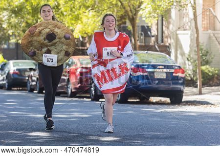 Suwanee, Ga / Usa - October 15, 2022:  Two Young Women Wear Cookies And Milk Costumes As They Near T