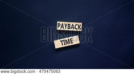 Payback Time Symbol. Concept Words Payback Time On Wooden Blocks. Beautiful Black Table Black Backgr