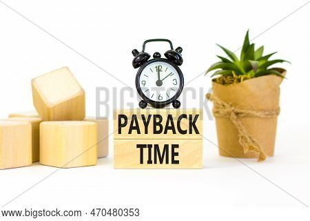 Payback Time Symbol. Concept Words Payback Time On Wooden Blocks. Beautiful White Table White Backgr