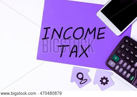 Text Showing Inspiration Income Tax. Business Idea Annual Charge Levied On Both Earned And Unearned 