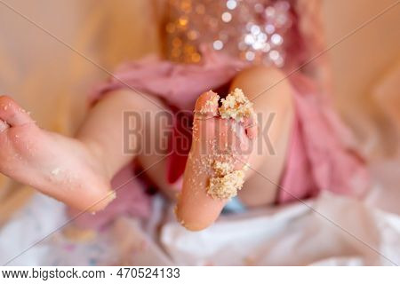 Feet Of Toddler Girl In Cake - Birthday Celebration