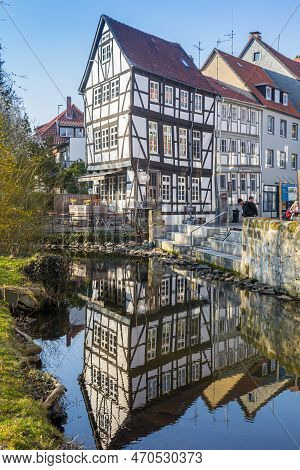 Wolfenbuttel, Germany - March 23, 2022: 
Oker River Reflecting A Historic Half Timbered House In Wol