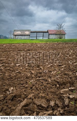 Freshly Plowed Field In Autumn And Hayfield - Otocec In Slovenia.