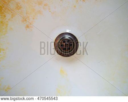 Mold On Bathroom Enamel. Black Dots Of Mold And Yellow Plaque. Requires Cleaning. Before Using Clean