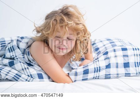 Child Wakes Up From Sleep In Bed. Kid Wakes Up In The Morning In The Bedroom.
