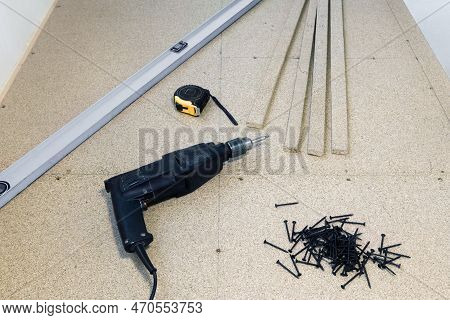 Subflooring From Chipboard For Facing Material. Fastening Wooden Slabs To The Logs With Screws And A
