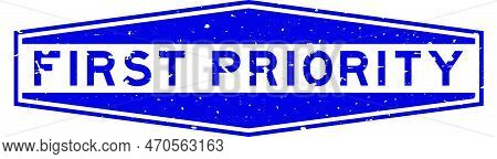 Grunge Blue First Priority Word Hexagon Rubber Seal Stamp On White Background