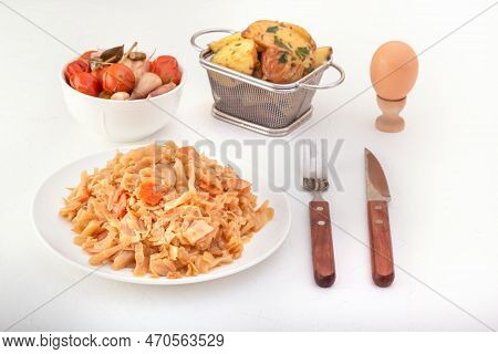 Stewed Cabbage - Bigos In A White Porcelain Plate Against The Background Of Pickled Vegetables And B