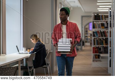 Pondered African American Guy Student Borrowed Books From Library To Effectively Study At University