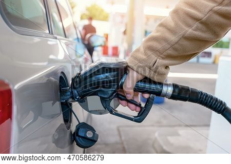 A Man Filling Fuel Tank Of His Car With Diesel Fuel At The Petrol Station Close Up, As Cost Of Fuel 