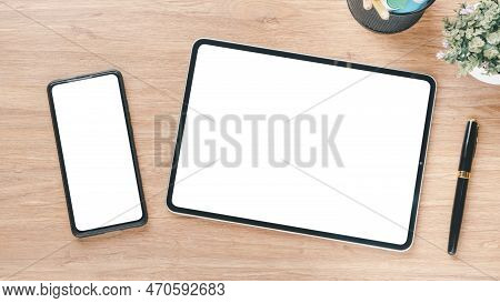 Wooden Desk Workplace With Blank Screen Digital Tablet And Smartphone, Pen And Office Gedget, Top Vi