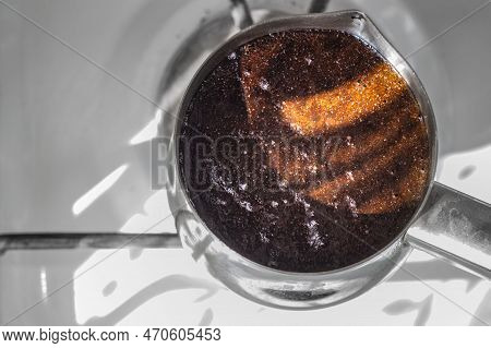 Barista Preparing Hot Tasty Drink From Copper Turk, Boils Water For Coffee On Small Fire In Cezve. C