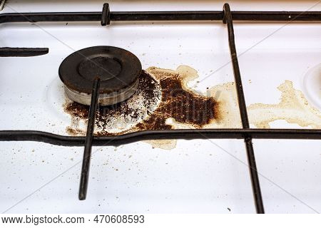 Dirty Gas Stove With Spilled Coffee From Cezve, Front And Background Blurred With Bokeh Effect
