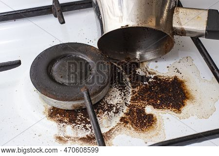 Dirty Gas Stove With Spilled Coffee From Cezve, Front And Background Blurred With Bokeh Effect