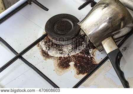 Dirty Gas Stove With Spilled Coffee From Cezve, Front And Background Blurred With Bokeh Effect