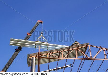 Mobile Crane Lifting Metal Roof Sheet On Palate Truss Up To Stock Above Steel Structure Roof Truss A