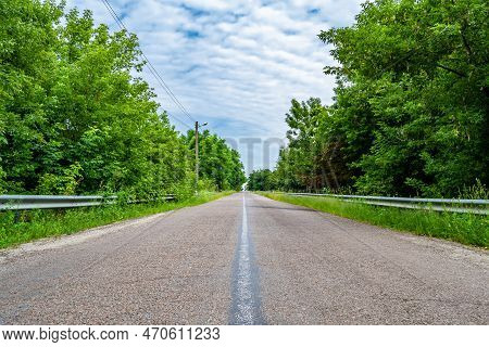 Beautiful Empty Asphalt Road In Countryside On Colored Background