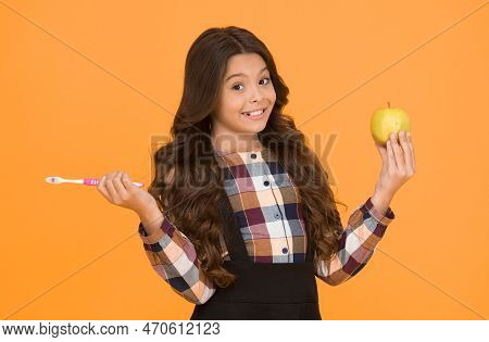 Brush Teeth Right Way. Happy Child Hold Tooth Brush And Green Apple. Teaching Oral Hygiene. Dental H