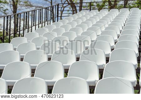 Seats Of Tribune On Sport Stadium. Concept Of Fans, Chairs For Audience, Cultural Environment Concep