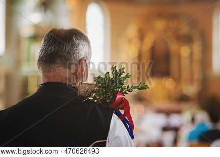 Wedding Elder In Silent Prayer At A Church Wedding