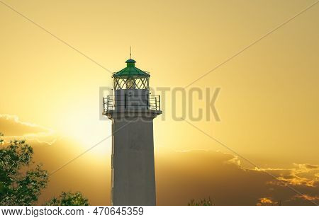 Lighthouse Landscape Shot Against Bright Sunset In Greece. Evening View Of Phare Beacon At Possidi C