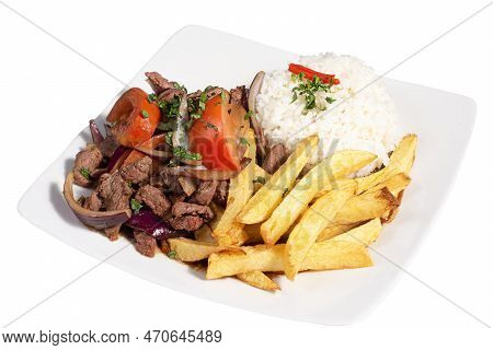 Peruvian Traditional Food. A Beef With Tomatoes, Onion, Rice And Fried Potatoes, Lomo Saltado.