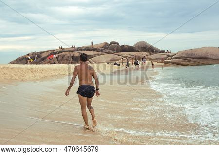 Florianopolis, Brazil - January 22, 2023 : People Relax On The Beach Mole, Florianopolis, Brazil.
