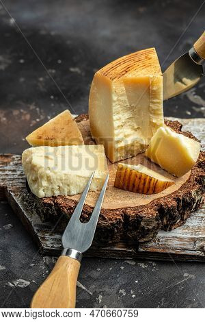 Gruyere Hard Yellow Cheese. A Traditional Swiss Hard Yellow Cheese Without Holes, With A Dark Crust 