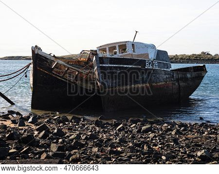 Remains Ruins Of Old Historical Capsized Tilted Fishing Boat Ship Wreck Ran Aground At Greenpoint Sh