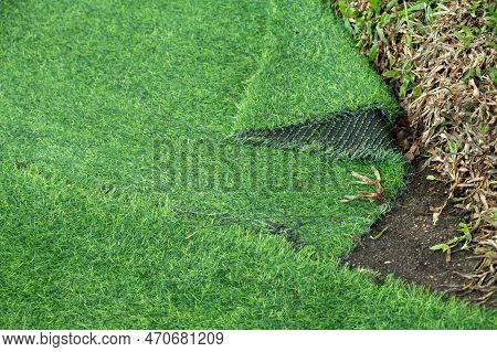 An Incomplete Green Artificial Turf Used For Covering Sport Arena Or Garden.