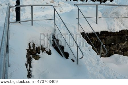 Maintaining Walkability For Pedestrians In The City. A Snow Storm Covered The Stairs. It Is Not Poss