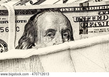 A Hundred-dollar Bill With A Medical Mask .the Concept Of Coronavrius Epidemic
