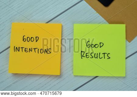 Concept Of Good Intentions And Good Results Write On Sticky Notes Isolated On Wooden Table.
